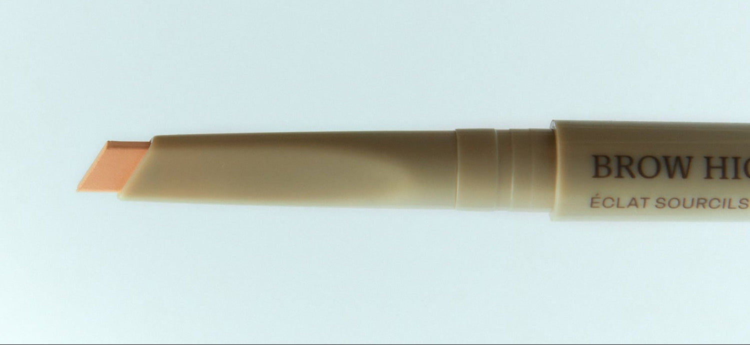 Brow highlighter pen on a light blue background